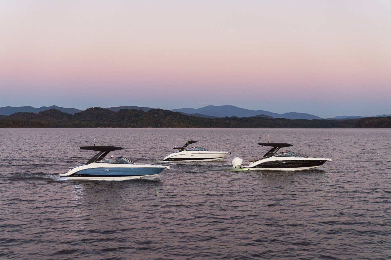 SLX 260, SLX 260 Outboard and SLX 260 Surf at twilight