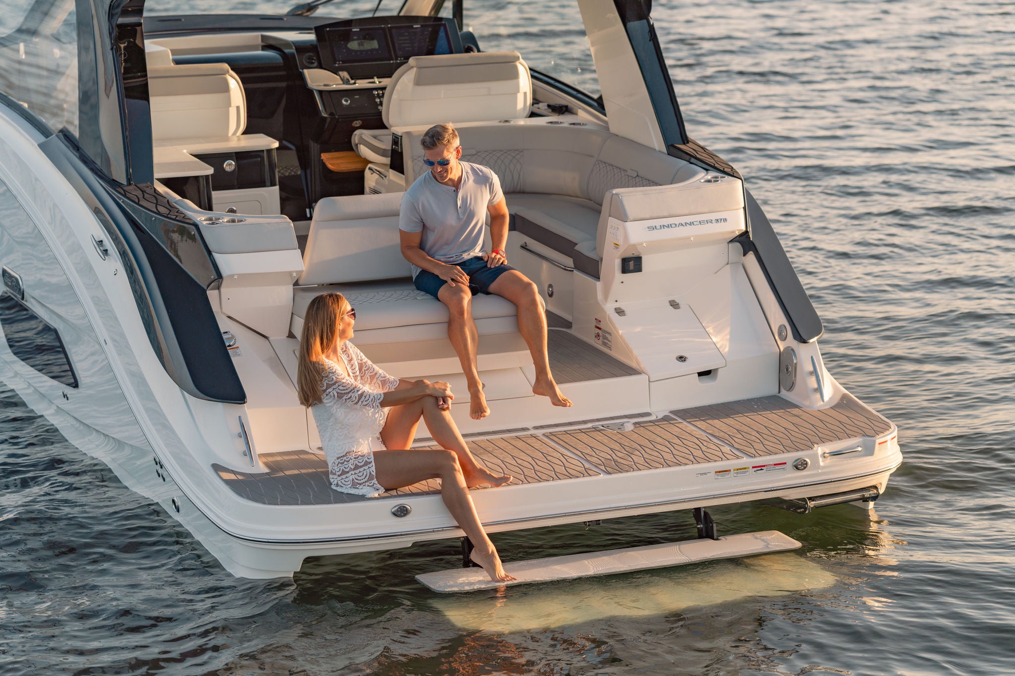 Couple aboard a Sundancer 370