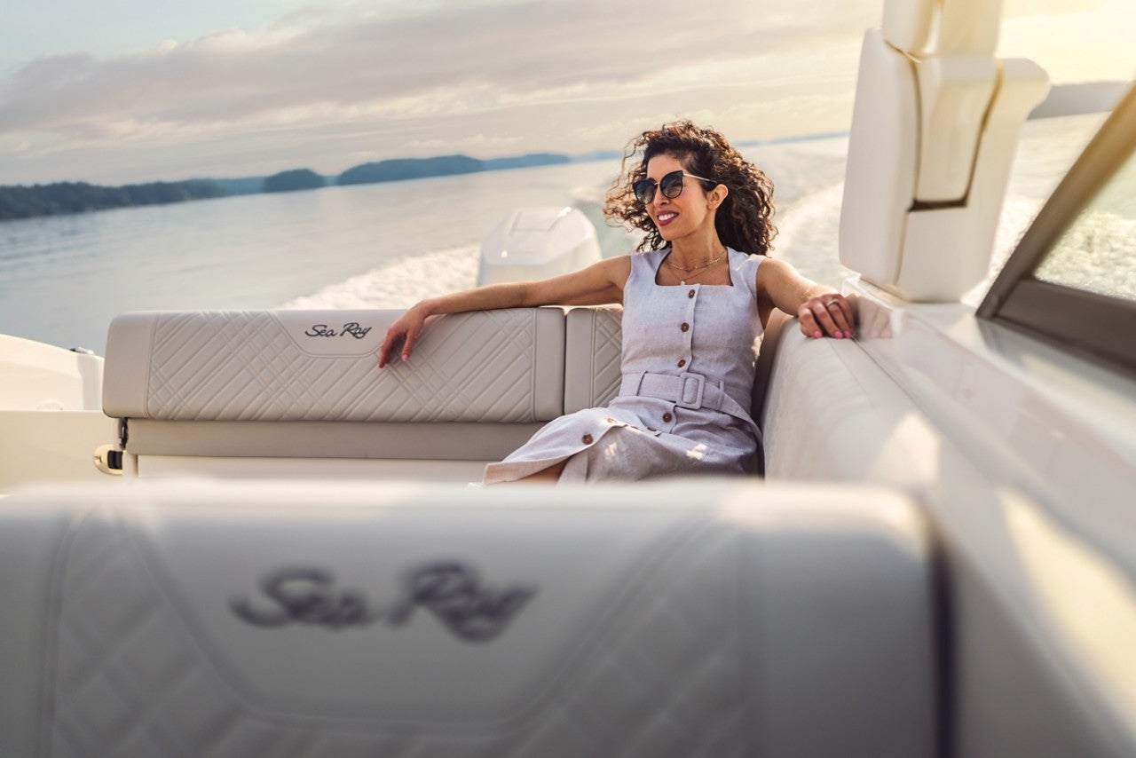 Woman aboard an SDX 270 Outboard