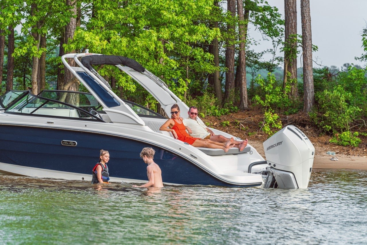 Kids swimming next to an SDX 250 Outboard while their parents watch