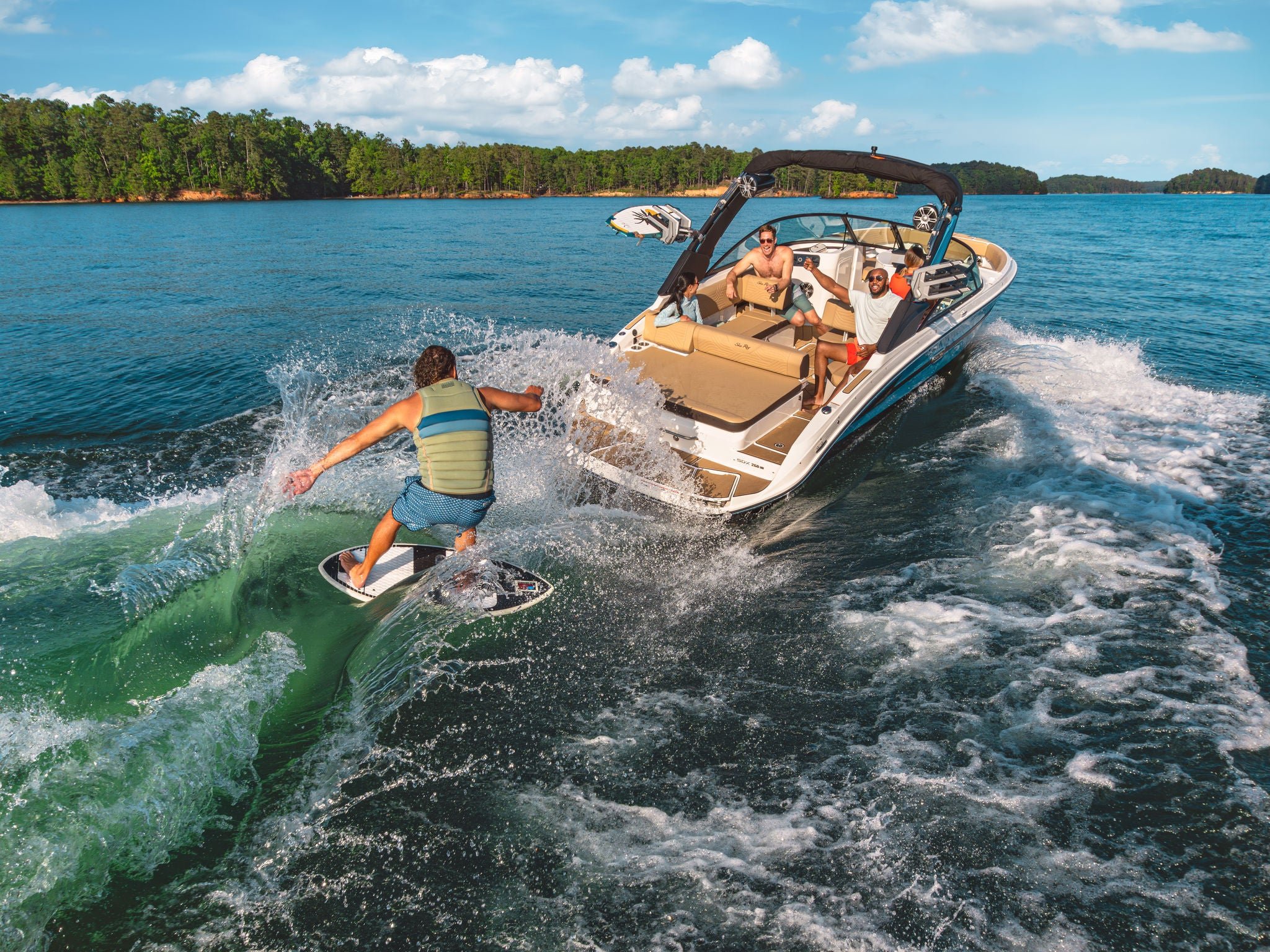 Man wakesurfing behind an SDX 250 Surf