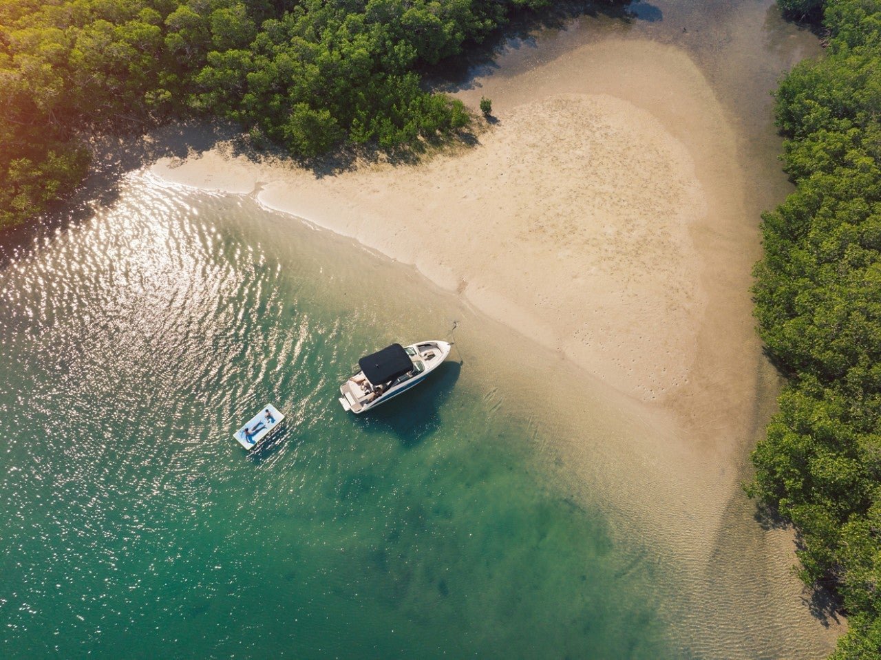 Aerial view of an SLX 260 at a secluded beach