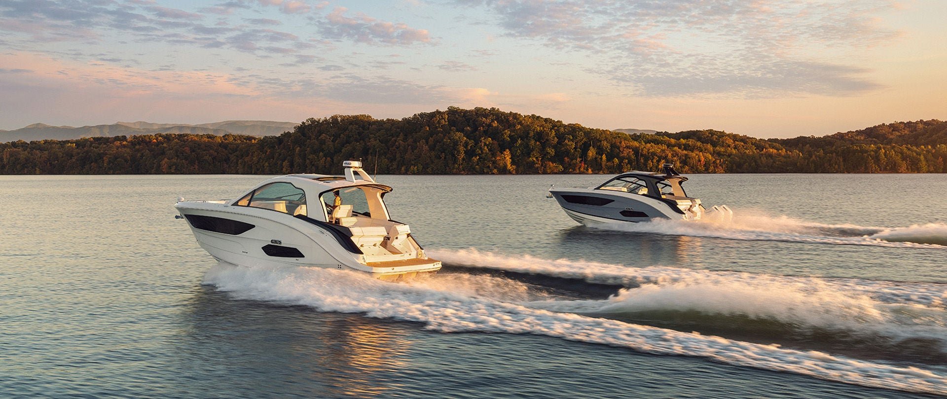 Two Sea Ray Sundancer 370 Series Boats at Sunset