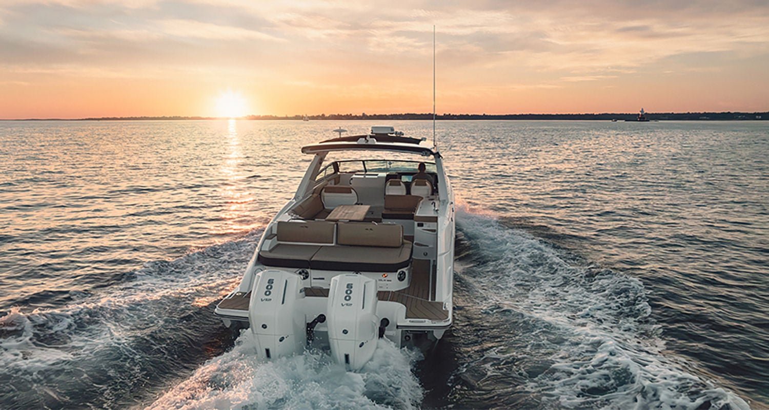 Sea Ray SLX 400 Outboard boat running at sunset