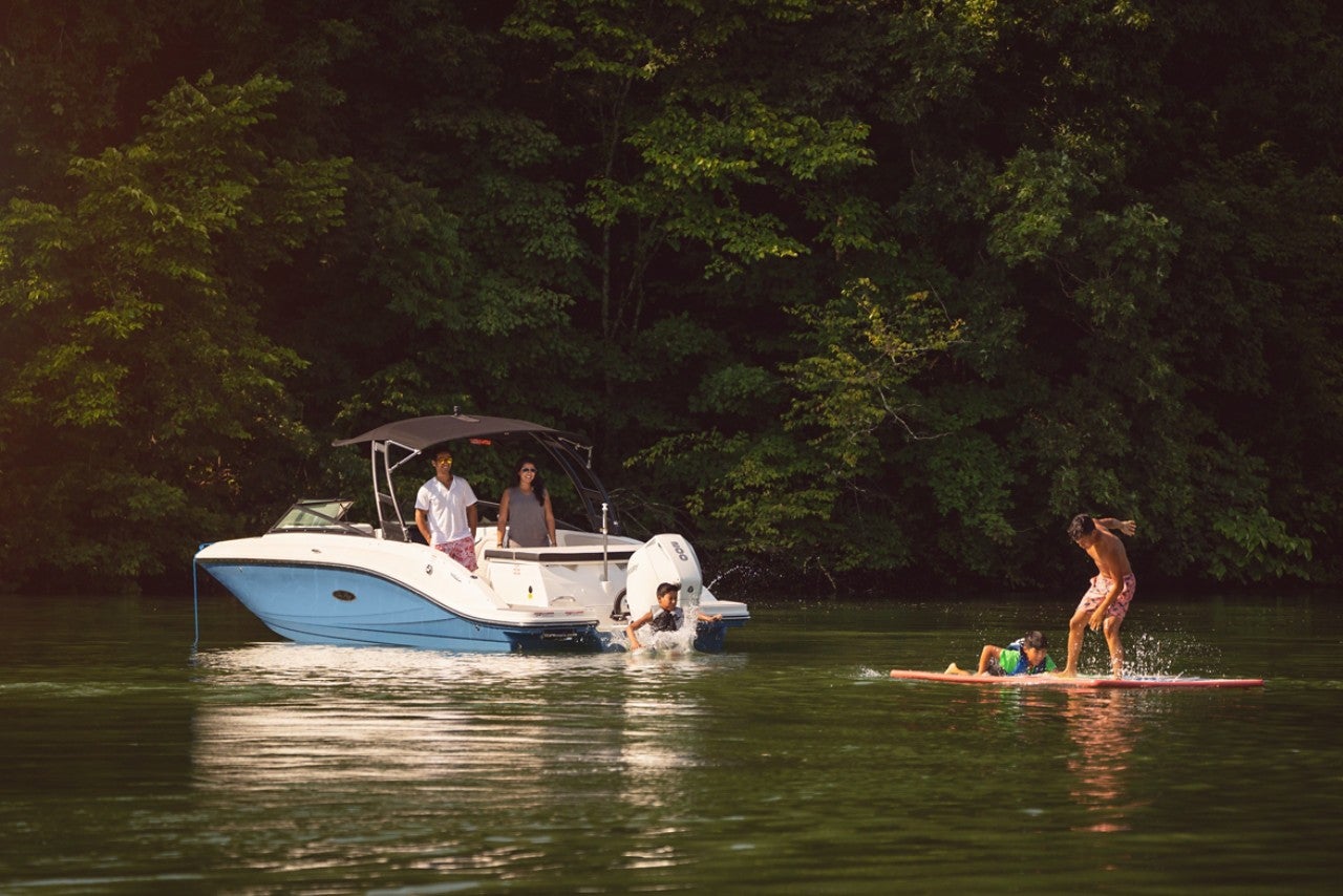 Family enjoying a day on the water with an SPX 230 Outboard