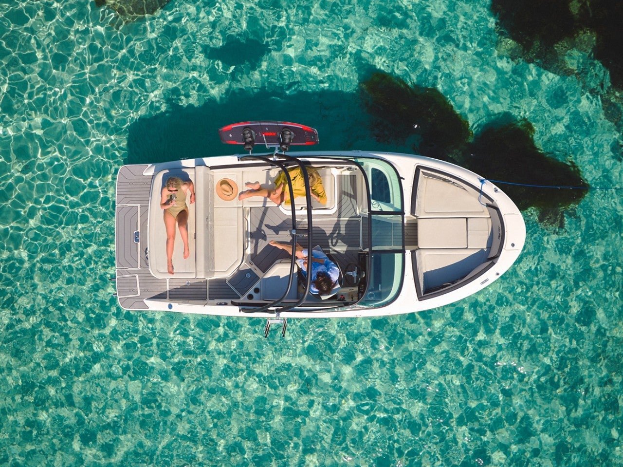 Aerial view of women lounging aboard an SPX 210