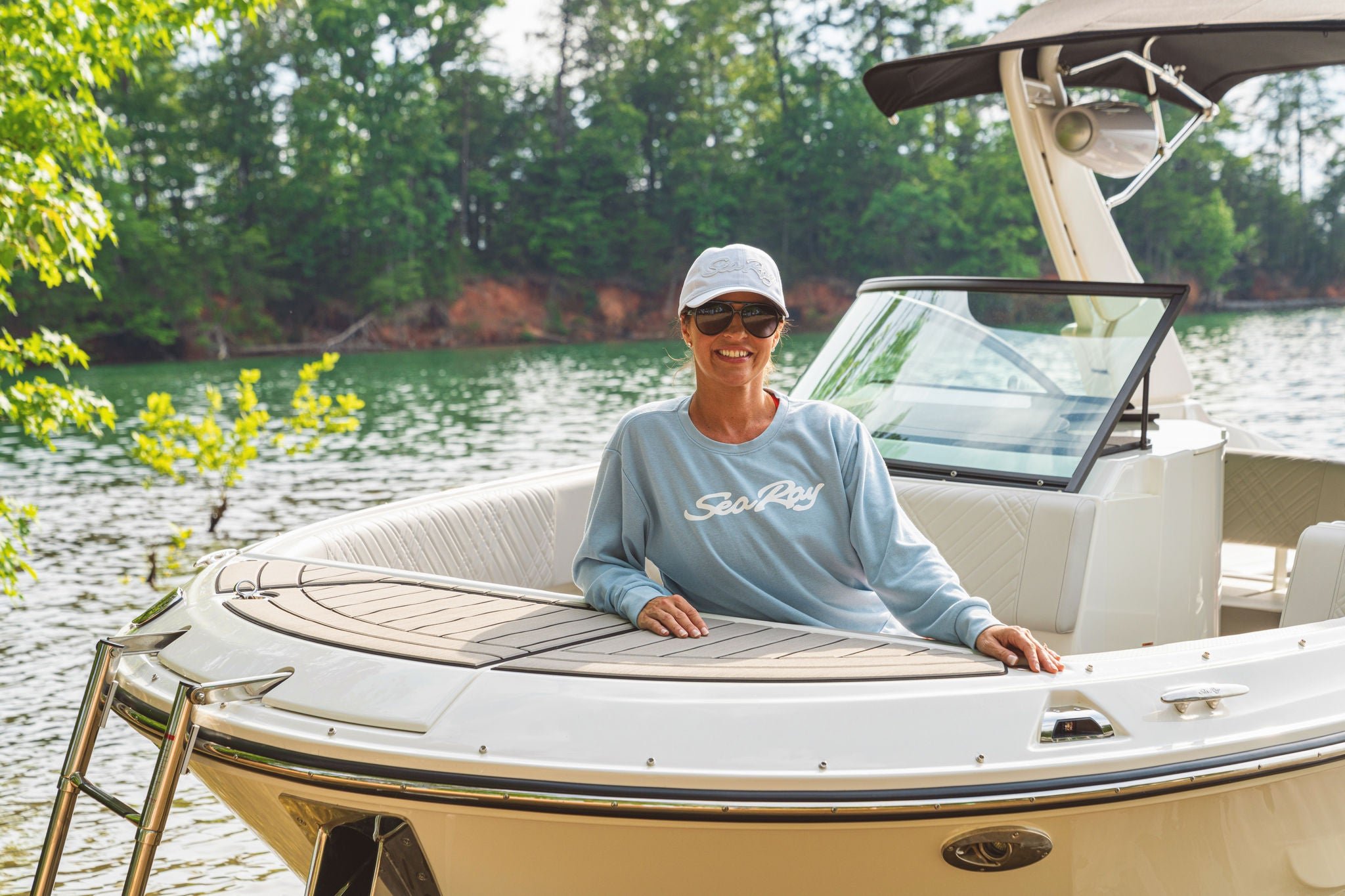 woman wearing a stonewash crew neck shirt on a Sea Ray boat