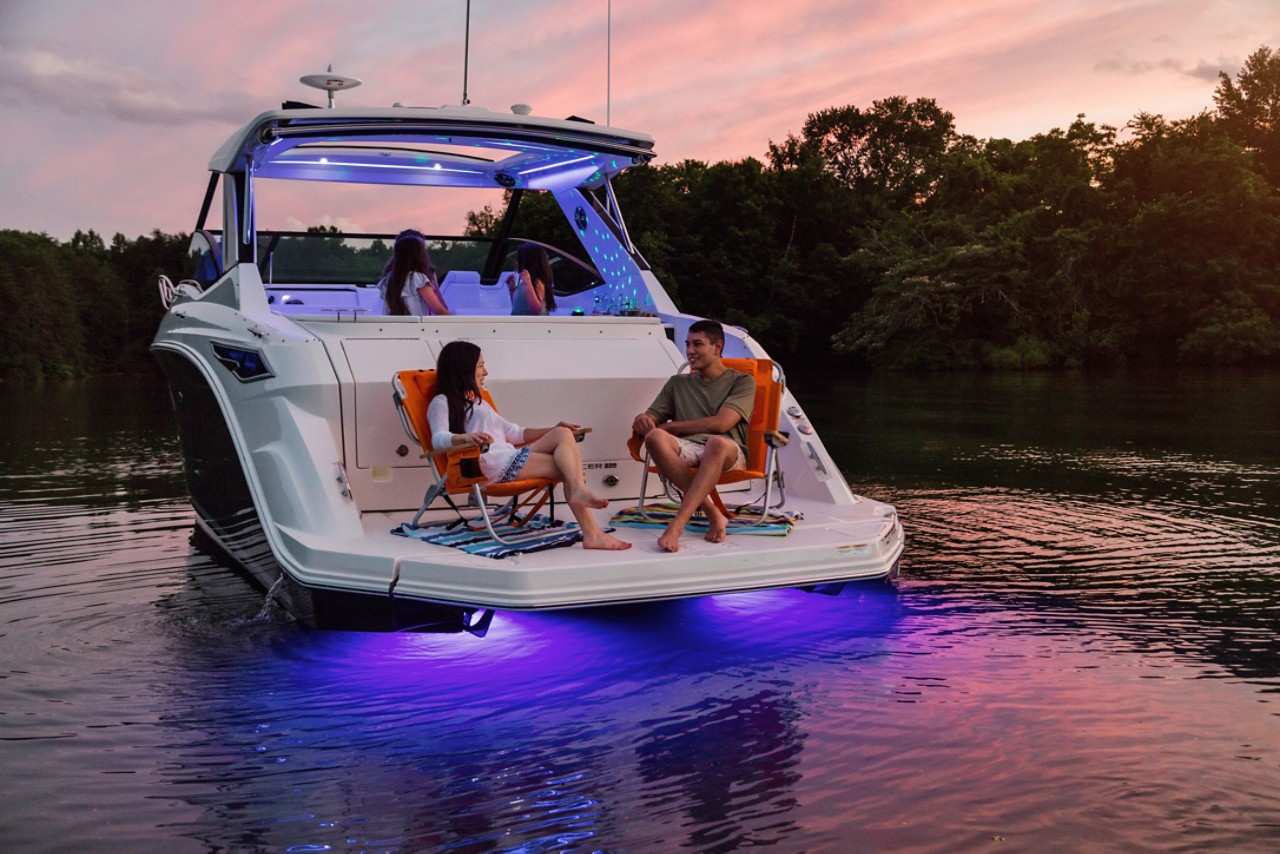  Sundancer 320 lifestyle family dancing accent underwater lighting swim platform twilight